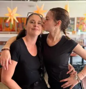 waiters, Karen and Celeste, share a fun moment.