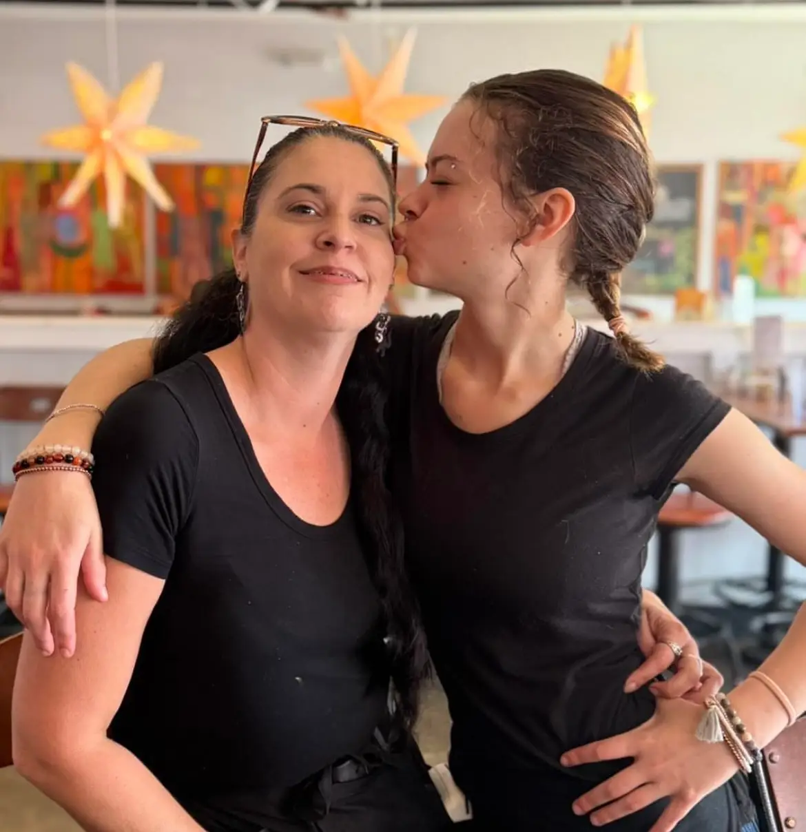 waiters, Karen and Celeste, share a fun moment.