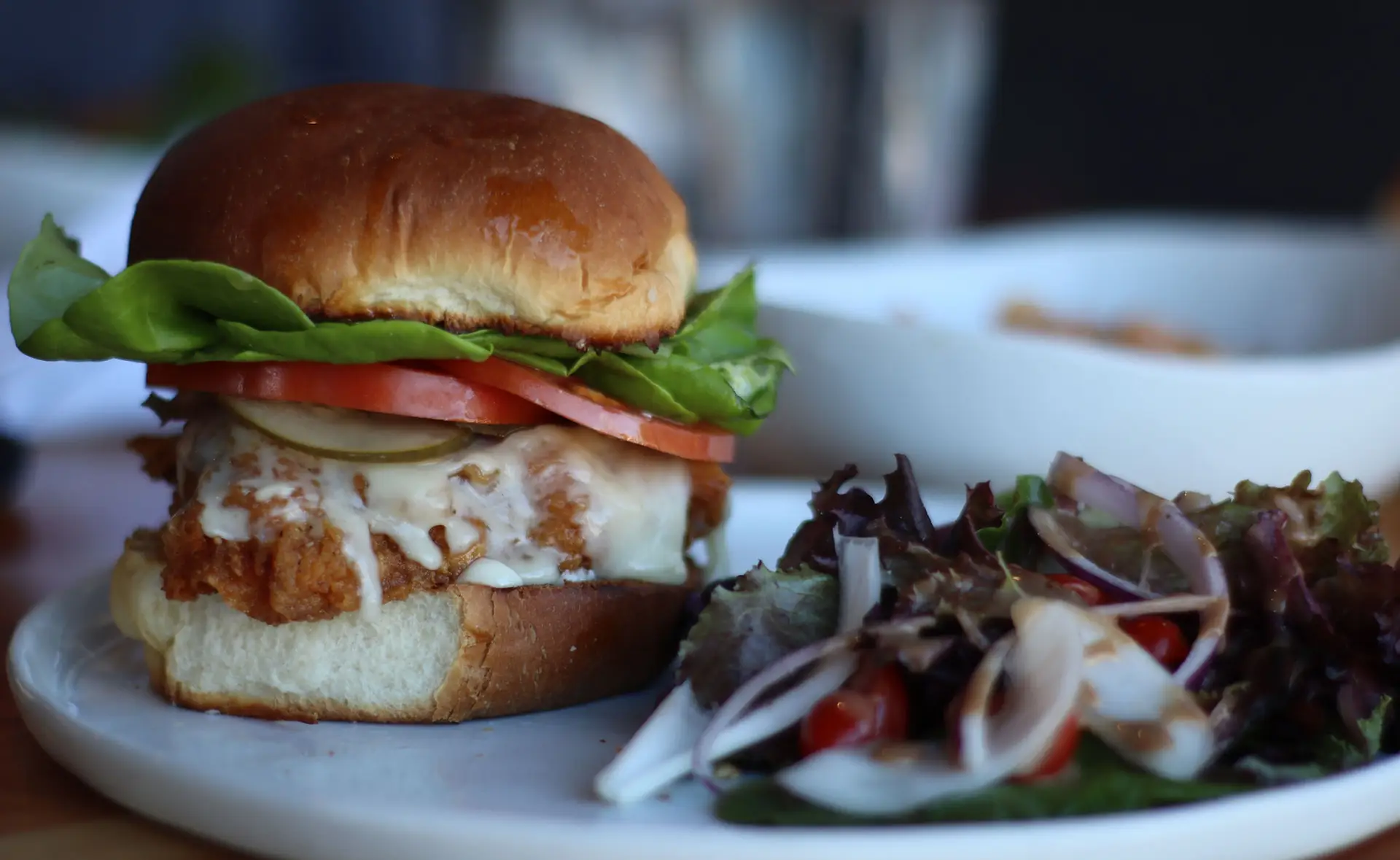 FRIED CHICKEN SANDWICH 16 Bibb lettuce, tomato, house made pickles and mayo served on house made wheat or milk bun​