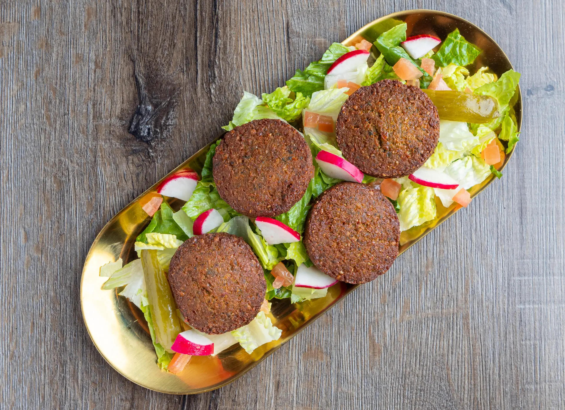 4 Falafel: chickpeas & fava beans, cilantro, onion and parsley with tahini sauce