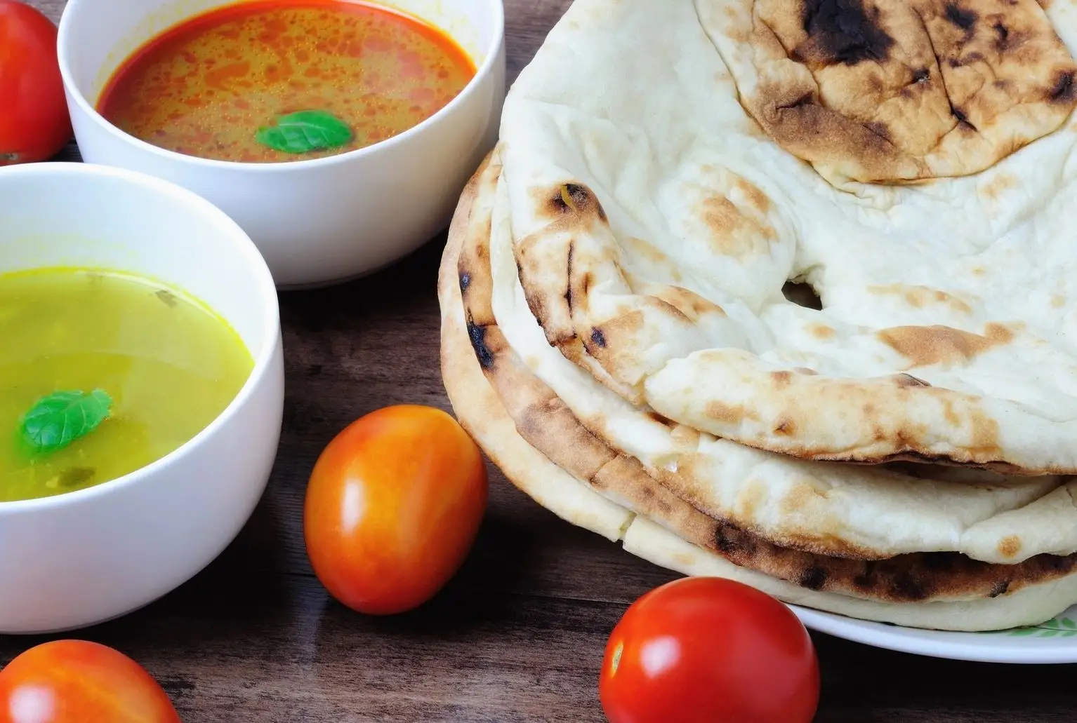 Fresh pita, cherry tomatoes and 2 sauces.