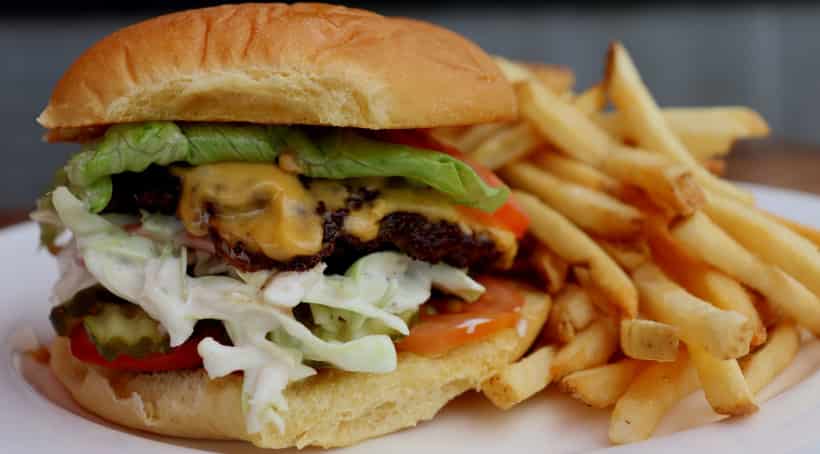 Cheeseburger and Fries , Beef burgers come with lettuce, tomatoes and special sauce.