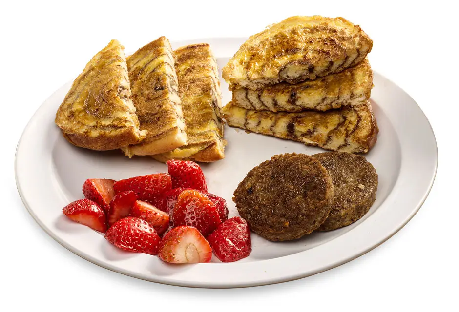 Cinnamon Roll French Toast Slicing our homemade cinnamon roll into 3 layers, we dip and griddle this sweet French toast to a golden brown then sprinkled with powder sugar and a side of berries.