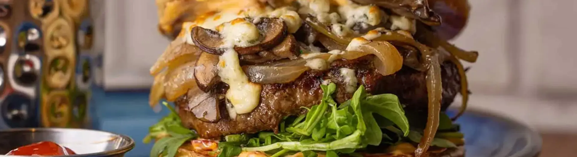 Black and Blue Mushroom Burger: Blue cheese / mushrooms / whiskey onions / arugula / Calabrian chili aioli