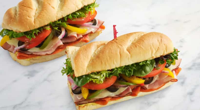 The Italian 12” Sandwich Black Forest Ham, Pepperoni, Provolone, Tri-Colored Peppers, Spring Mix, Tomato, Red Onion, Black Olives, OBV and Spicy Brown Mustard on Toasted Baguette