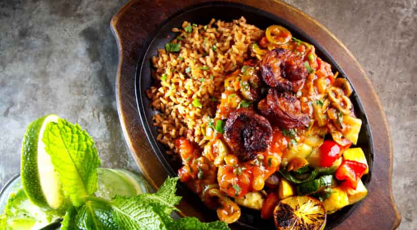 Camarones Diablos, Jumbo shrimp and jalapeño wrapped in bacon, cilantro, jalapeño salsa & Valentina.